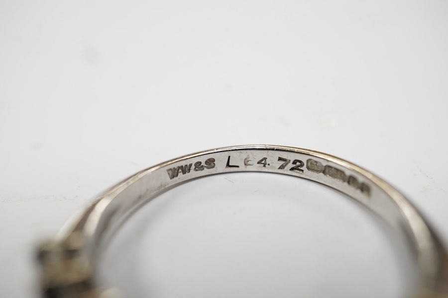 A modern 18ct white gold and nine stone marquise cut sapphire set half hoop ring, size M, gross weight 3.2 grams. Condition - fair